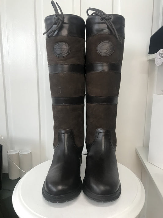 A pair of brown, waterproof boots with a lace-up closure and a steel shank, displayed against a white background.