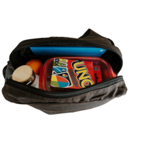 A dark gray zippered pouch shown open, containing a red box of UNO cards, a blue item, and other small objects, against a plain white background.